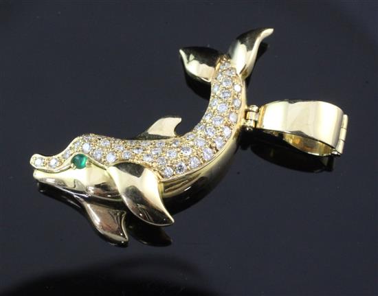 An 18ct gold and diamond set dolphin pendant by Cartier, 1.5in.